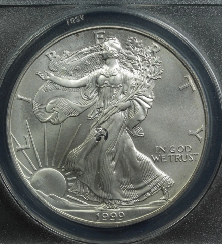 1999 Silver Eagle struck-through error showing fabric impression on coin surface